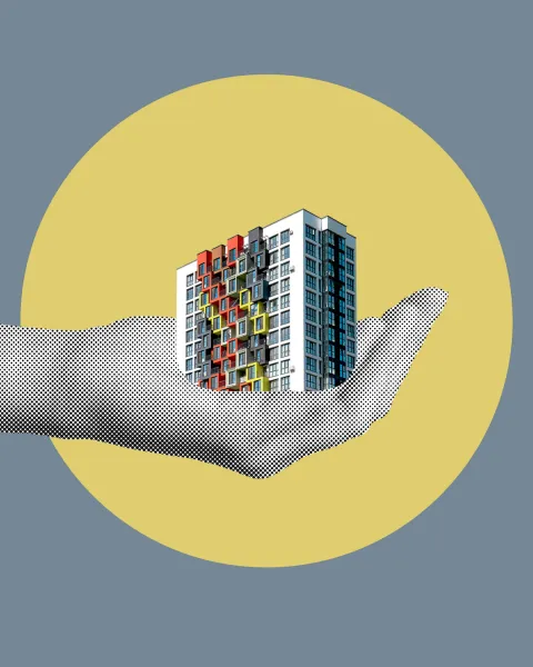 Mano sujetando edificio collage
